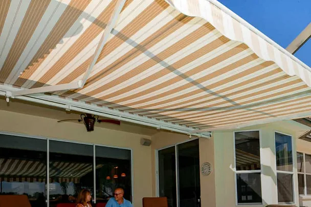 custom retractable awning extended over a patio