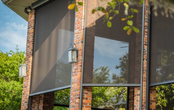 traditional motorized screen on a covered porch