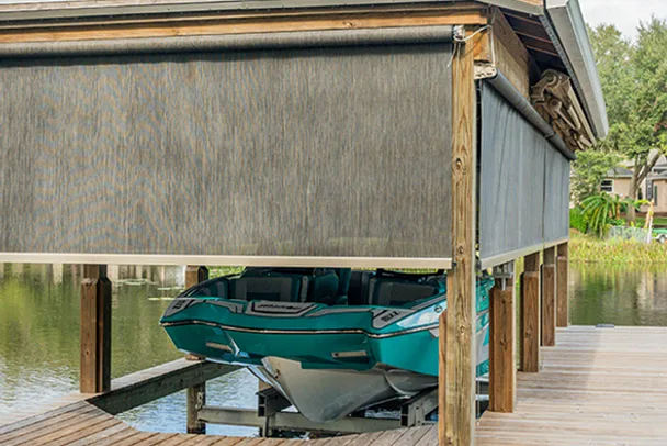 motorized exterior screens shading a covered outdoor patio