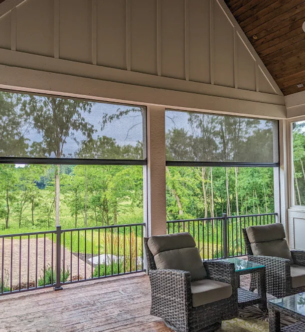 outdoor living space enclosed with motorized exterior screens
